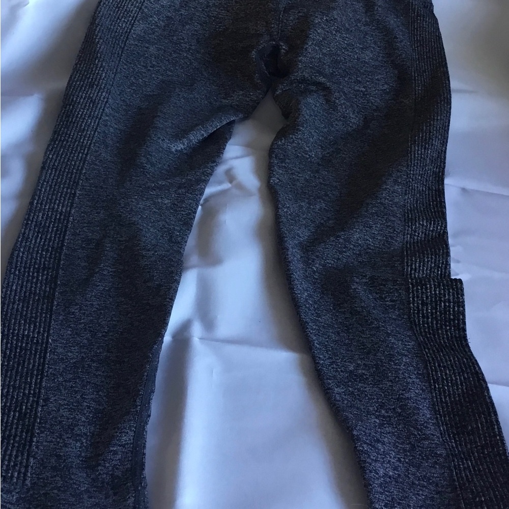 Forever21 women leggings, 1 dark gray medium, 1 light gray small. Set of 2